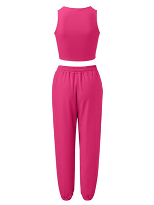 a woman wearing a pink top and pants