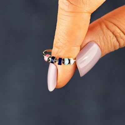 a woman's hand with a ring on it