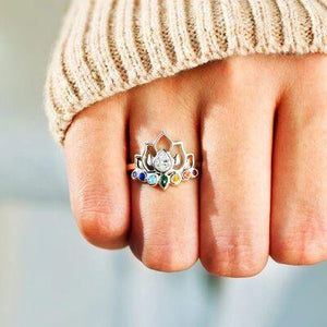 a person wearing a ring with a spider on it