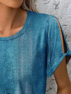 a close up of a woman wearing a blue shirt