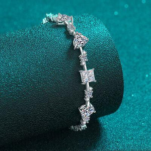 a diamond bracelet sitting on top of a blue cloth