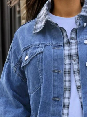 a woman wearing a blue jean jacket and a white t - shirt