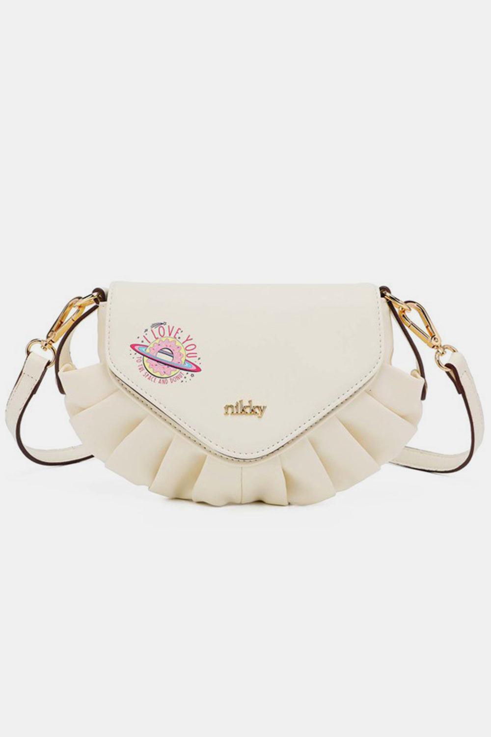 a white purse with a ruffled strap