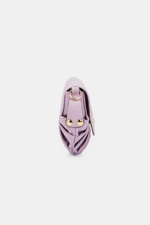 a small purple purse on a white background