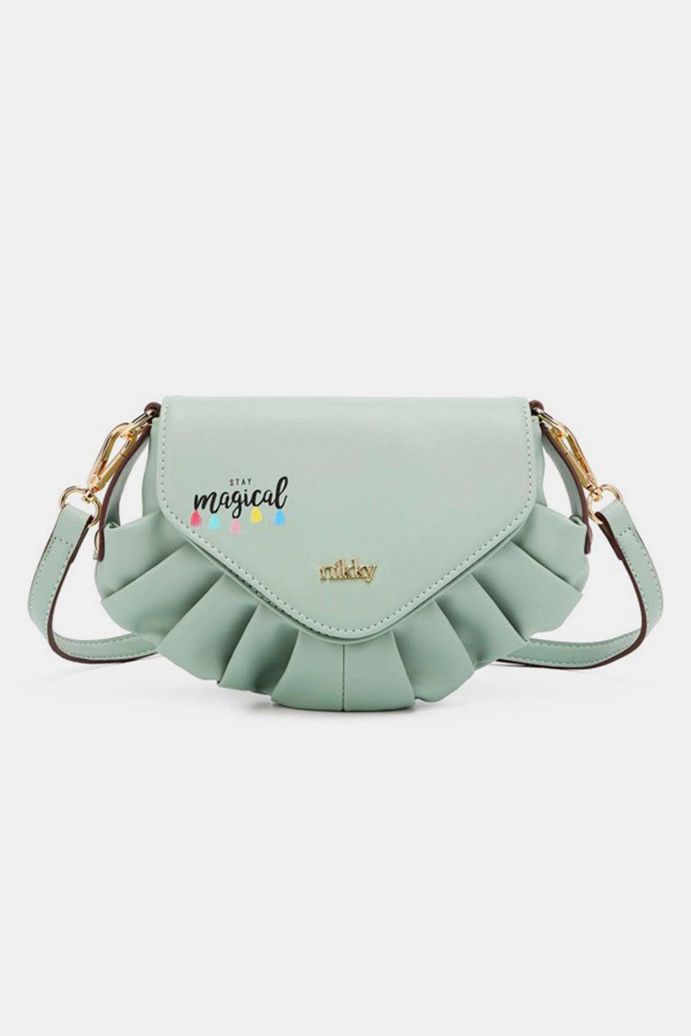 a mint green purse with a flower decoration