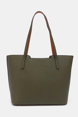 a green tote bag with a brown handle