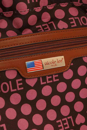 a brown and pink polka dot purse with a label on it