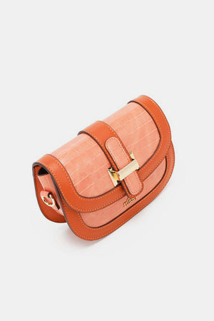 a small orange purse with a gold buckle