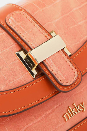 a close up of a pink purse with a gold buckle