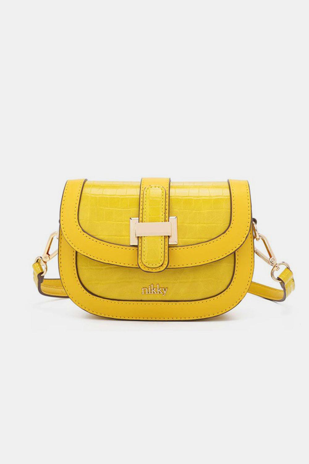 a yellow cross body bag on a white background