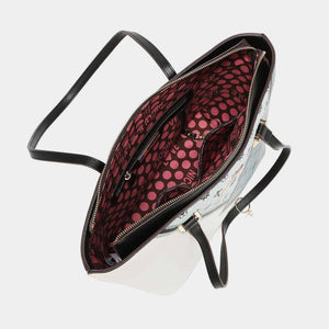 a white purse with a red and black polka dot pattern