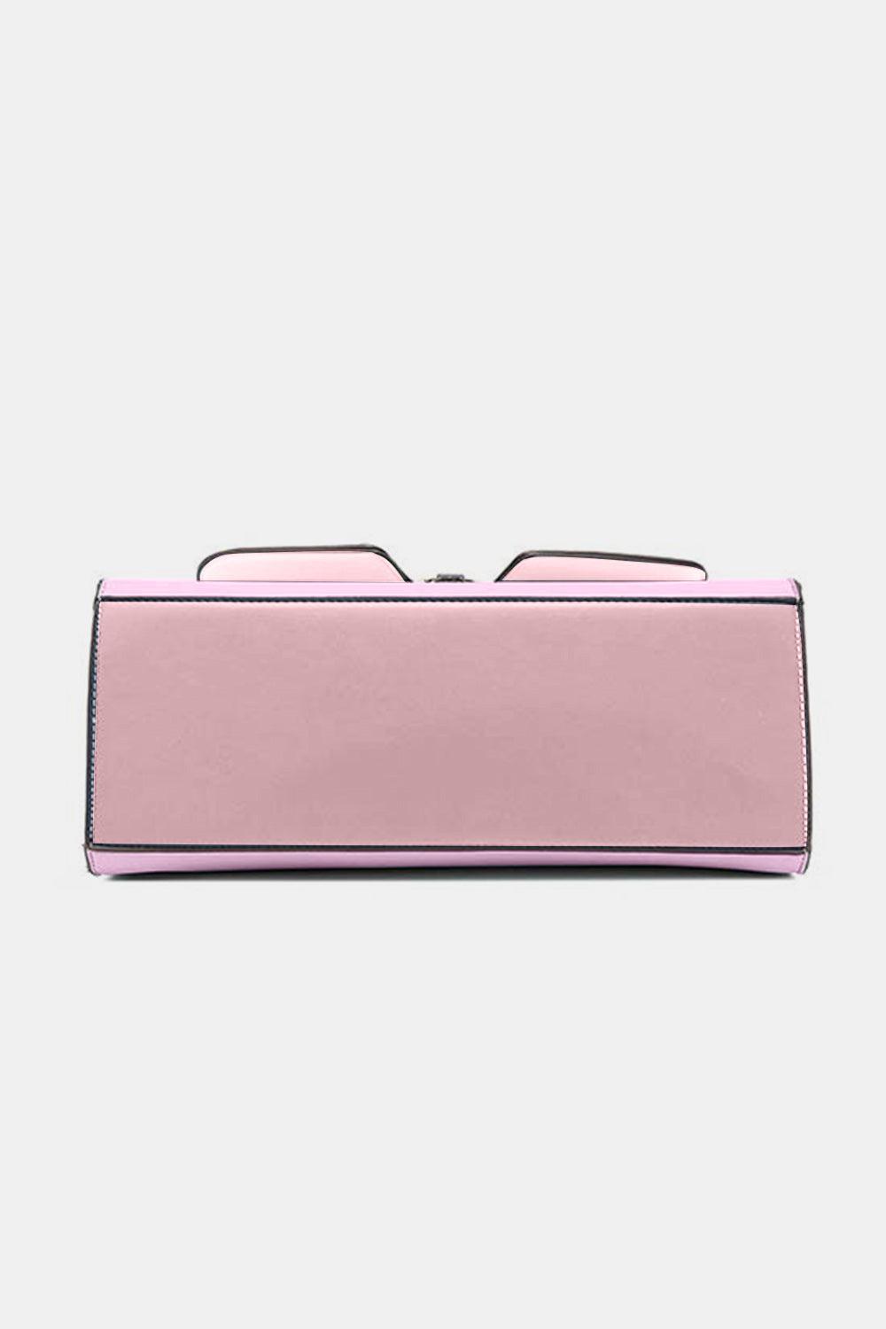 a pink purse with a pair of glasses on top of it