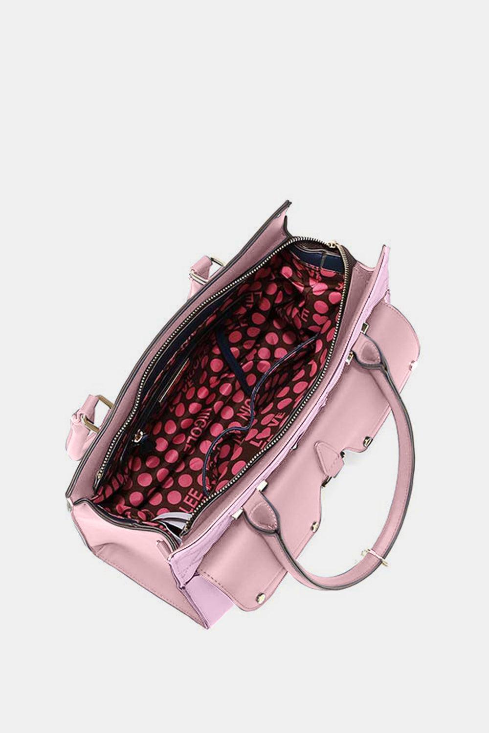 a pink handbag with a pink polka dot design