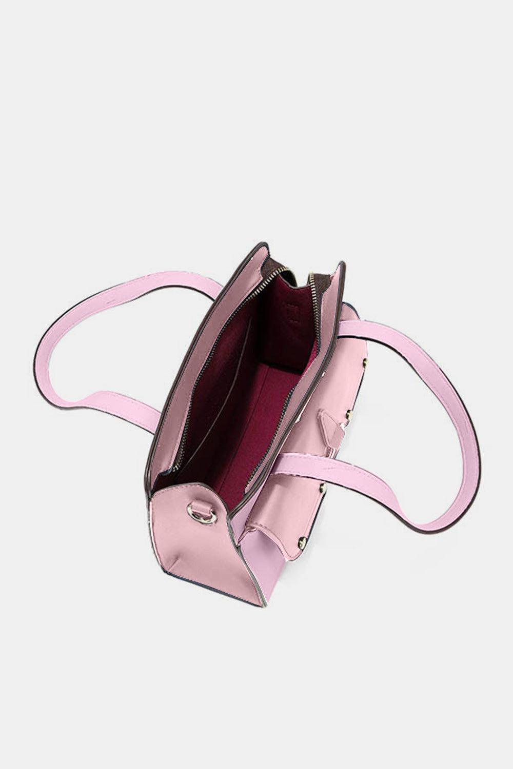 a pink handbag with a pink strap