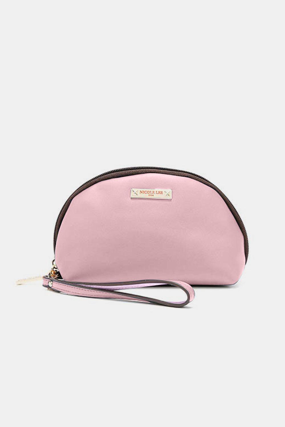 a pink purse with a brown strap