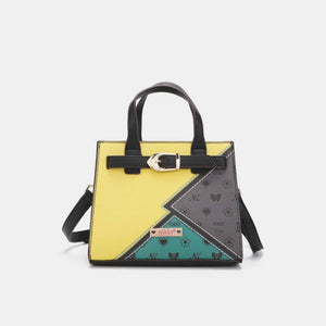 a yellow and black handbag with a patchwork design