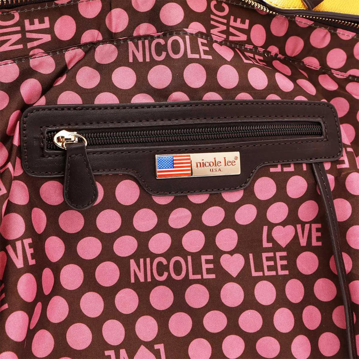 a pink and brown polka dot purse with a name tag