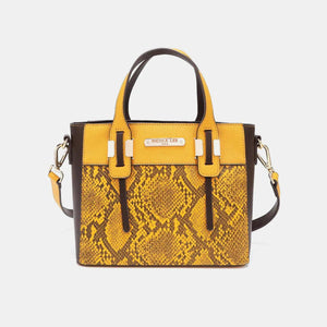 a yellow and black handbag with a snake skin pattern