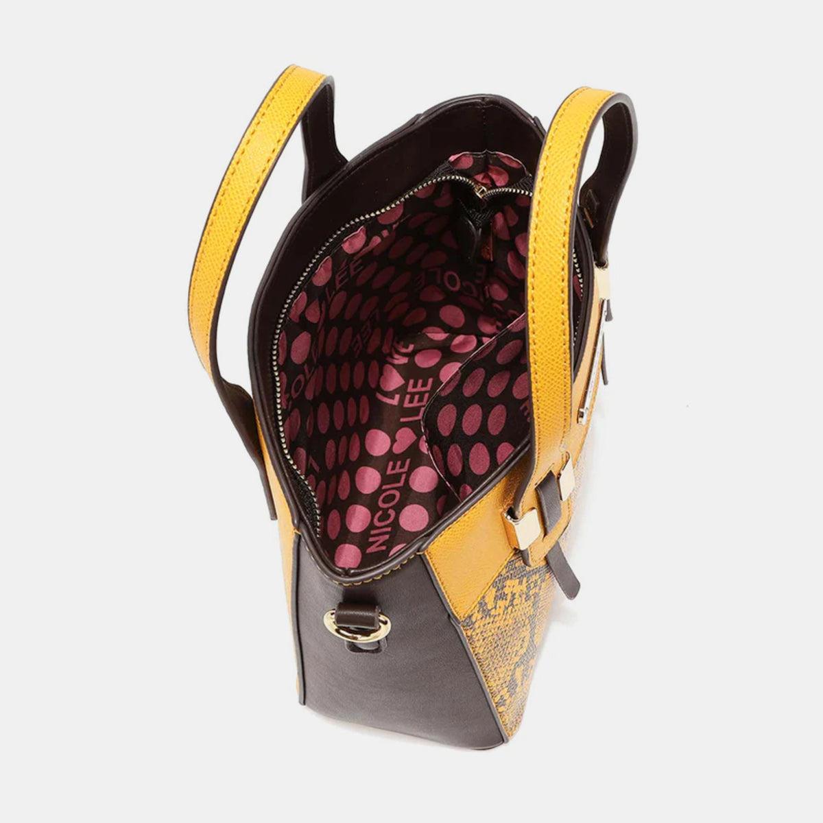 a yellow and black handbag with a polka dot pattern