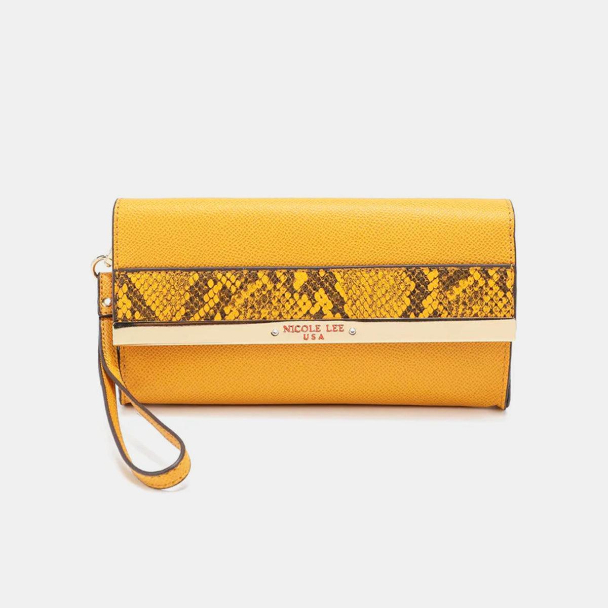a yellow wallet with a snake skin pattern