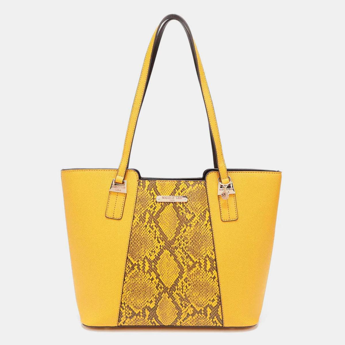 a yellow handbag with a snake skin pattern