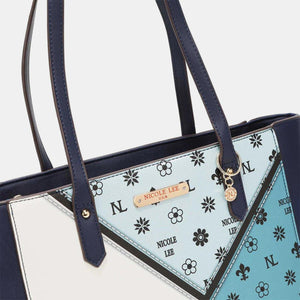 a blue and white purse with a triangle design