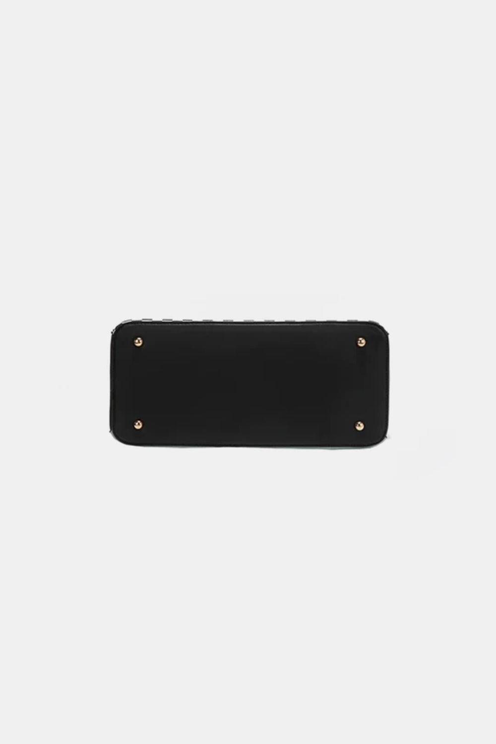 a black leather wallet with rivets on the front