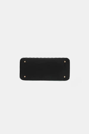 a black leather wallet with rivets on the front