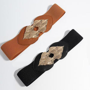 a pair of black and brown belts on a white surface