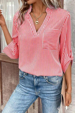 a woman wearing a red and white striped shirt