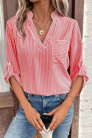 a woman wearing a red and white striped shirt