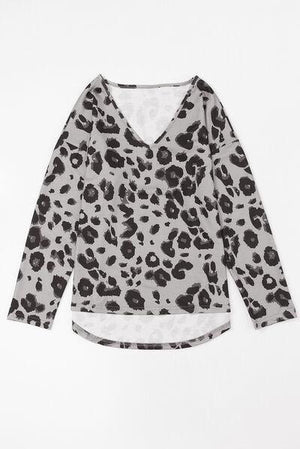 a white and black top with a leopard print