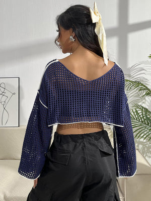 a woman wearing a blue top and black pants