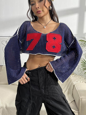 a woman in a crop top posing for a picture