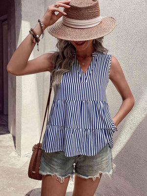 a woman wearing a blue and white striped top