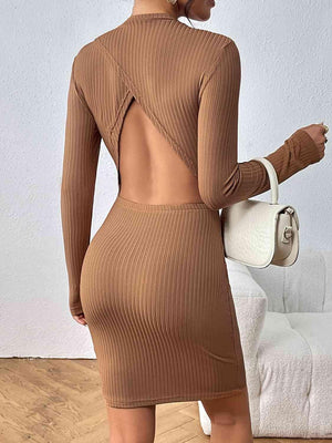 a woman wearing a brown dress with a cut out back