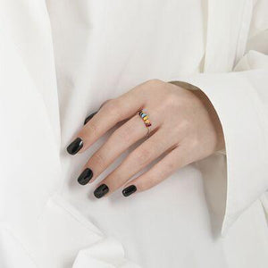 a woman's hand with a ring on it