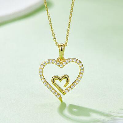 a diamond heart pendant on a chain