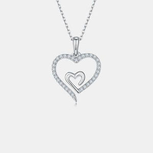 a diamond heart pendant on a chain