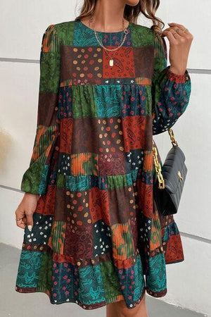 a woman wearing a multi colored dress