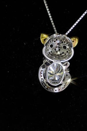 a necklace with a cat on top of it
