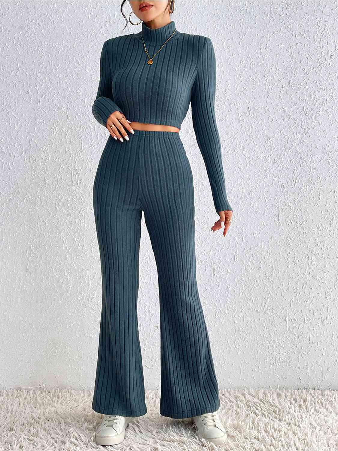 a woman in a green sweater and pants