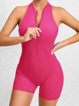 a woman in a pink swimsuit posing for a picture