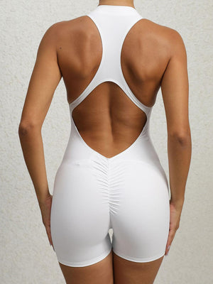 the back of a woman in a white swimsuit