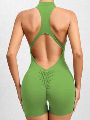 the back of a woman in a green swimsuit