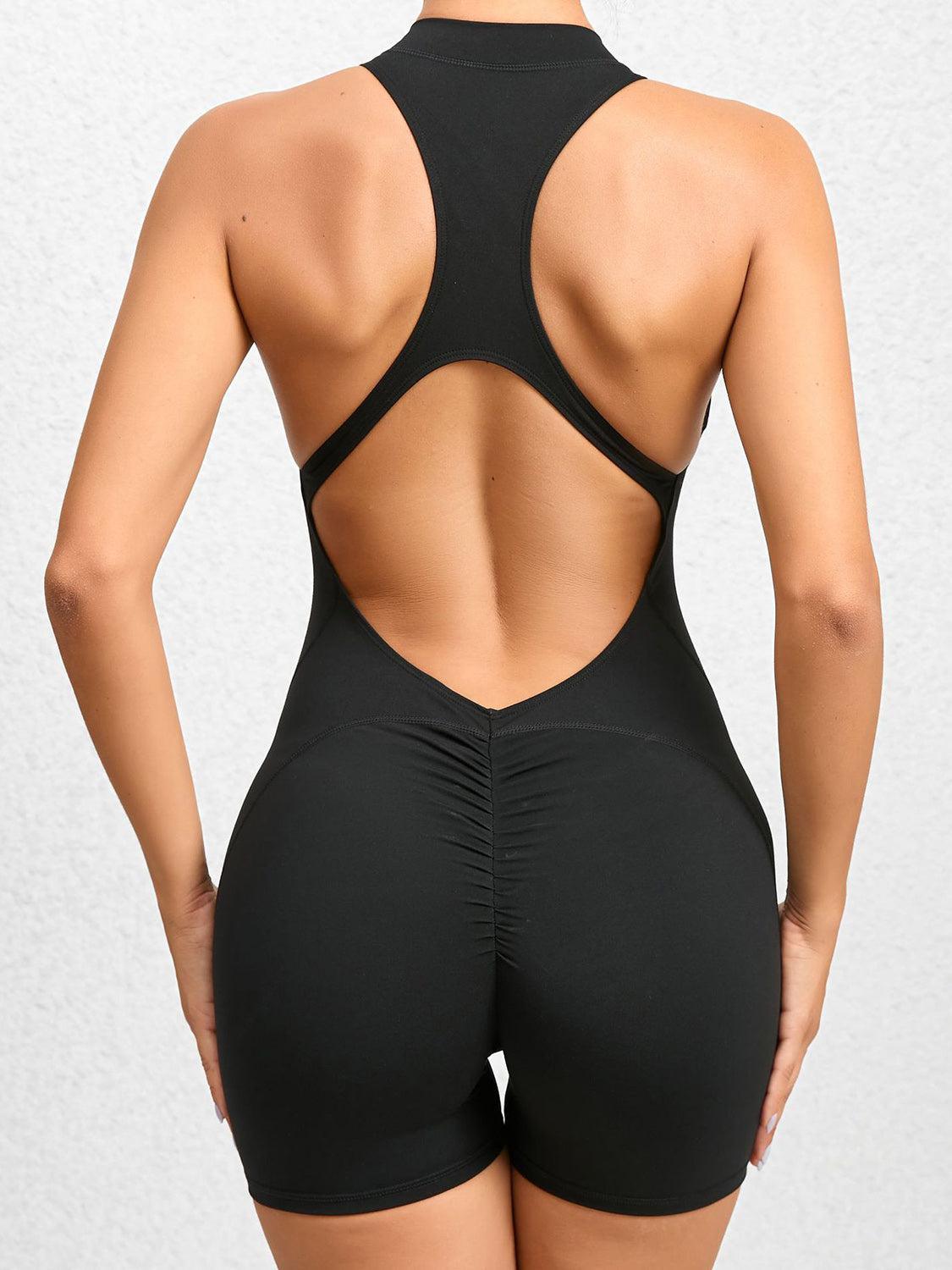 the back of a woman in a black swimsuit