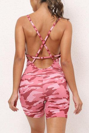 a woman in a pink camo sports bra and shorts