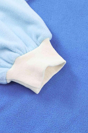 a close up of a blue and white blanket