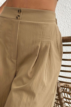 a woman is standing in a chair with her back to the camera