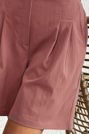 a close up of a person wearing shorts